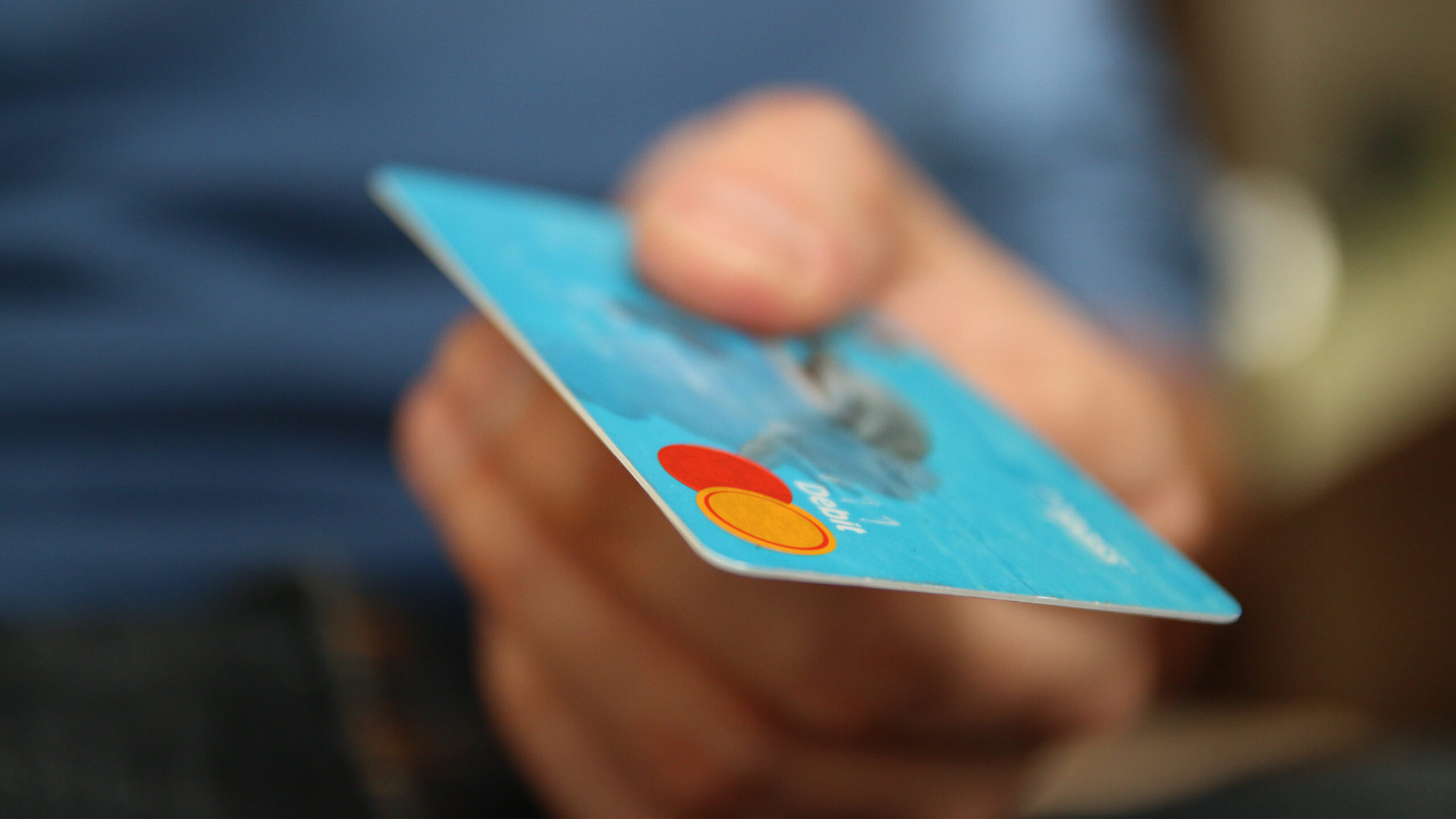 Close up of hand holding bank card