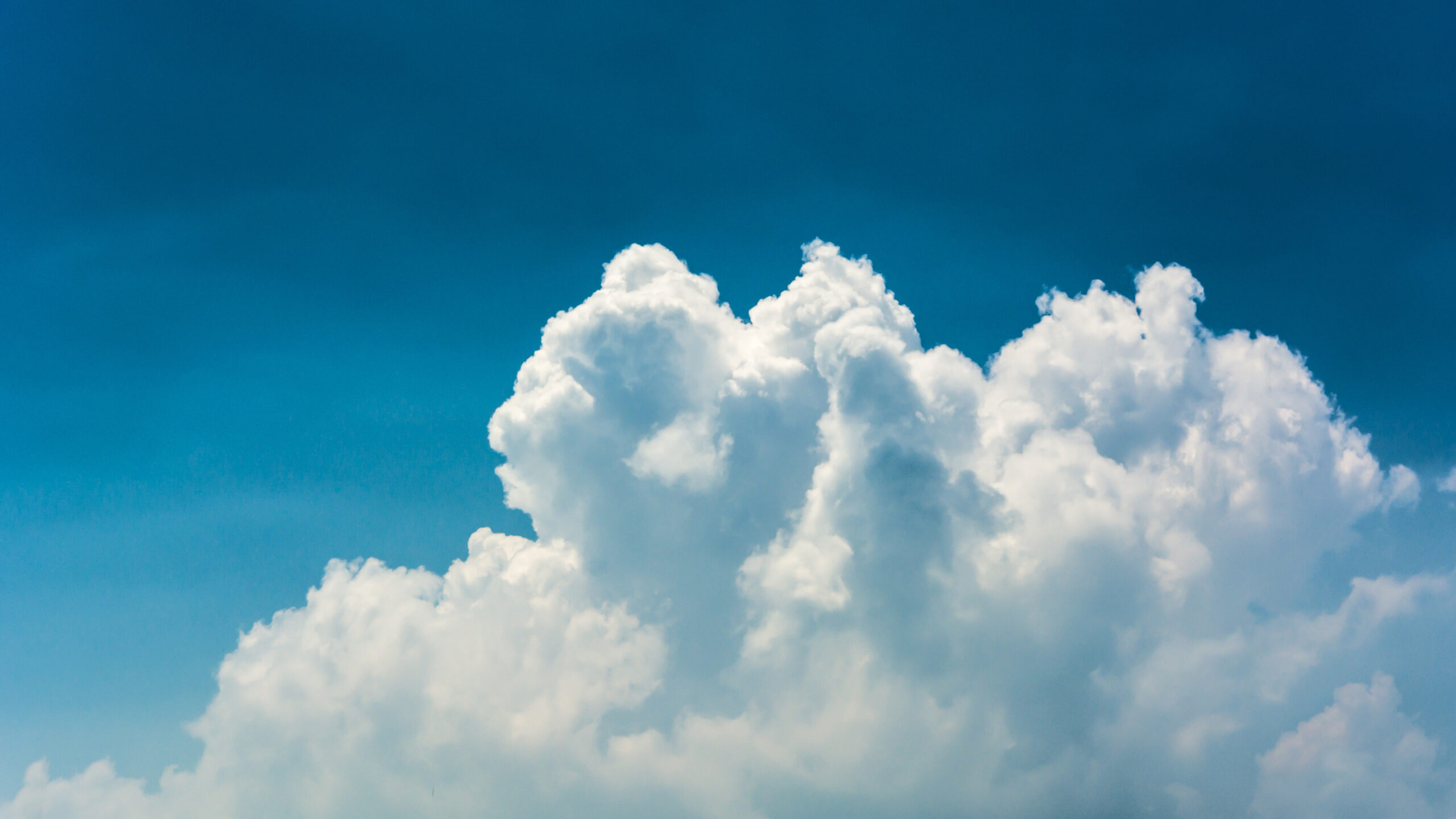 view of a fluffy clouds on the blue sky