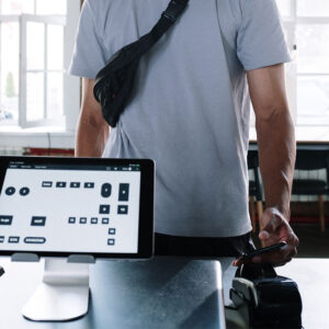 Person making contactless payment using smartphone